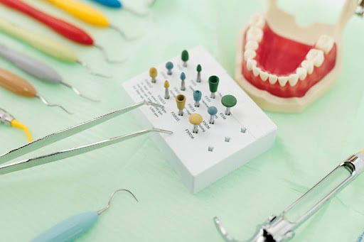 Dental instruments and polishing burs arranged on dental tray Dental instruments and polishing burs arranged on dental tray