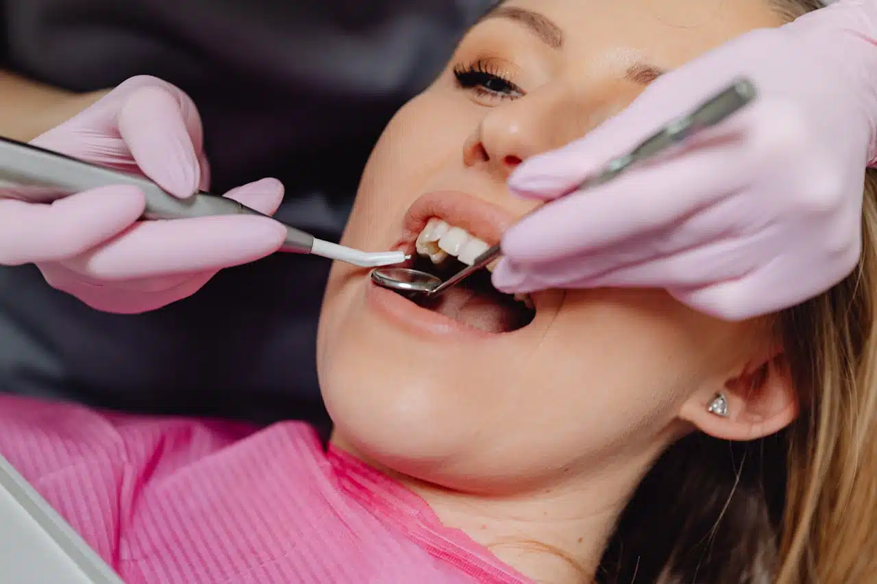 Dr. Chad Canal filling a patient's tooth during a dental procedure